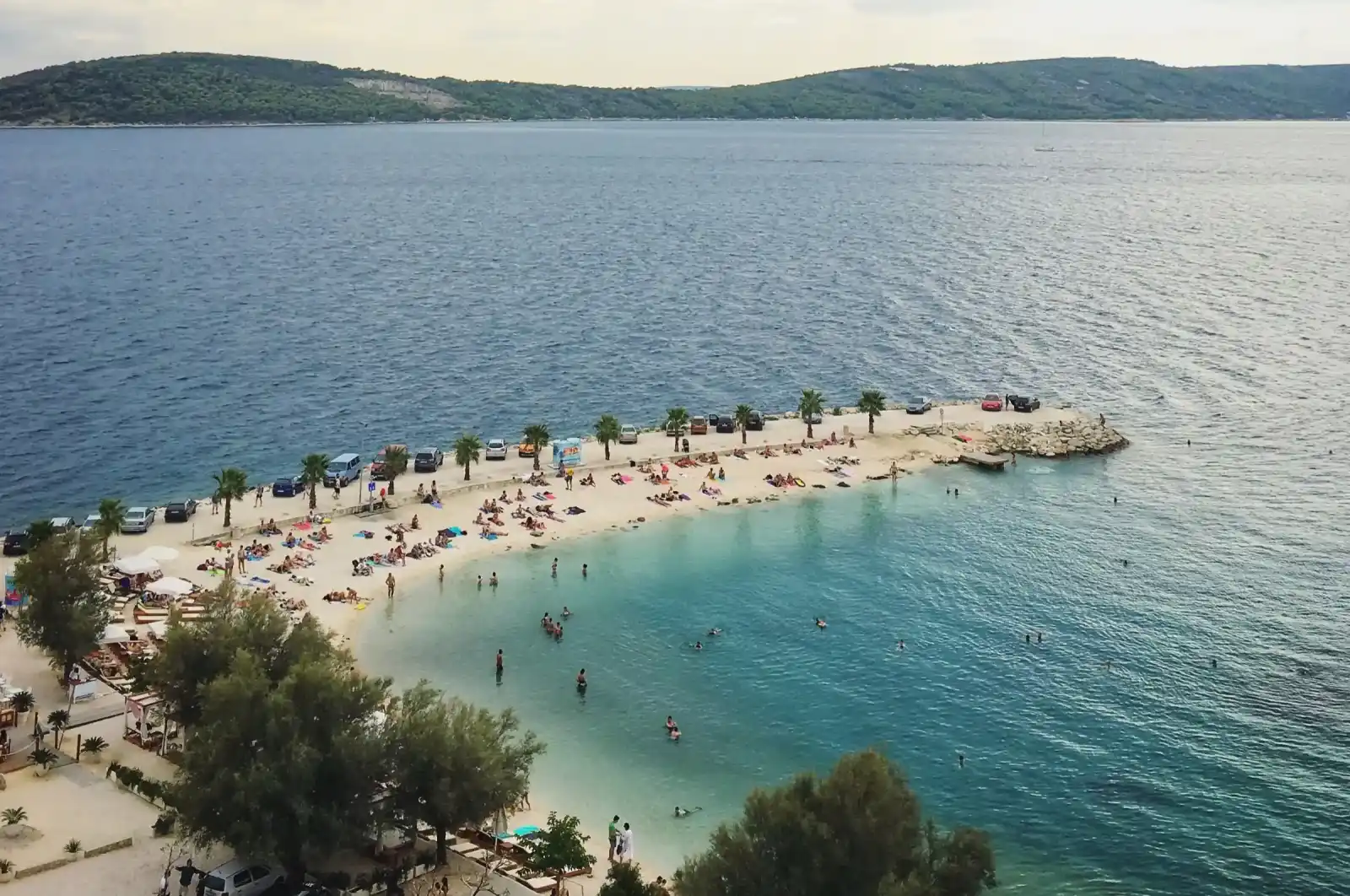 Crystal-clear water at the secluded Kašjuni Beach